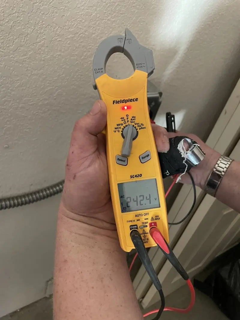 Voltage testing with clamp meter during Generator Installation in Lawrence